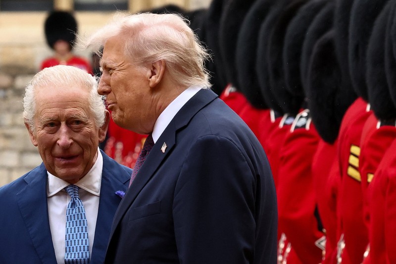 King Charles III (right) and US President Donald Trump review the guard of honour during the ceremonial welcome at Windsor Castle, Berkshire, on day one of the president's second state visit to the UK. Picture date: Wednesday September 17, 2025.    Jonathan Brady/Pool via REUTERS