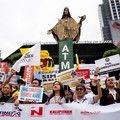 Filipino protesters raise placards during a protest denouncing corruption, in Quezon City, Metro Manila, Philippines, September 11, 2025. REUTERS/Lisa Marie David