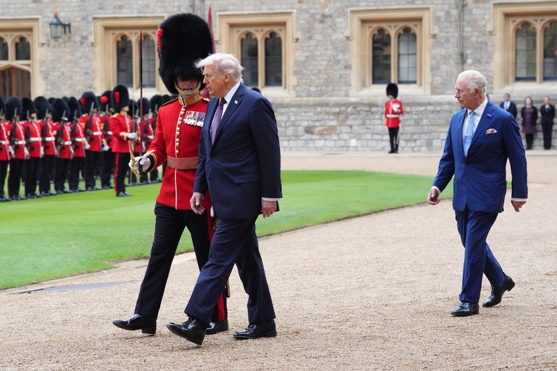 King Charles III (right) and US President Donald Trump review the guard of honour during the ceremonial welcome at Windsor Castle, Berkshire, on day one of the president's second state visit to the UK. Picture date: Wednesday September 17, 2025.    Jonathan Brady/Pool via REUTERS