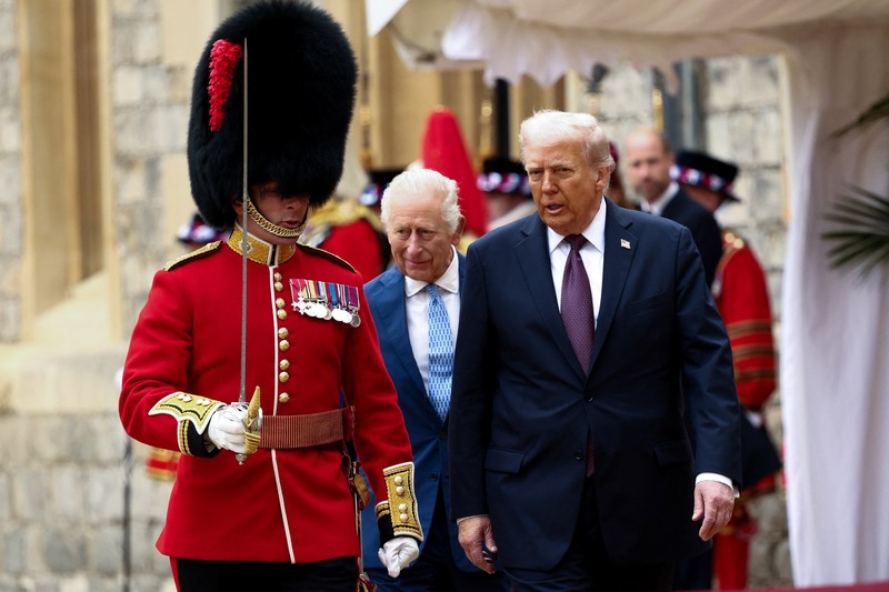 King Charles III (right) and US President Donald Trump review the guard of honour during the ceremonial welcome at Windsor Castle, Berkshire, on day one of the president's second state visit to the UK. Picture date: Wednesday September 17, 2025.    Jonathan Brady/Pool via REUTERS