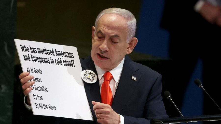 A screen displays Israeli Prime Minister Benjamin Netanyahu during his address, at the 80th United Nations General Assembly (UNGA) at U.N. headquarters in New York City, U.S., September 26, 2025. REUTERS/Jeenah Moon