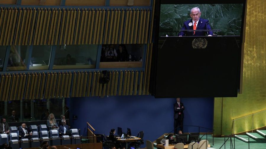 A screen displays Israeli Prime Minister Benjamin Netanyahu during his address, at the 80th United Nations General Assembly (UNGA) at U.N. headquarters in New York City, U.S., September 26, 2025. REUTERS/Jeenah Moon
