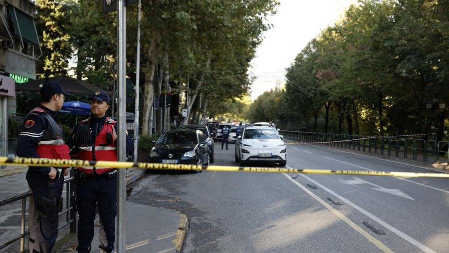 Police officers secure the perimeter outside the Appeal Court where a judge was shot dead, in Tirana on October 6, 2025. A man on trial opened fire in a courtroom in the Albanian capital Tirana on October 6, 2025, killing the judge and injuring two others, police said. 
Appeals court judge Astrit Kalaja was presiding over the man's case when he opened fire, police said, adding that the man was promptly arrested. (Photo by Adnan Beci / AFP)