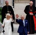 Britain's King Charles and Queen Camilla leave following a service at the Basilica of St Paul's Outside the Walls, where King Charles became a Royal Confrater of the Abbey, as part of their first state visit to the Holy See since Pope Leo XIV's elect