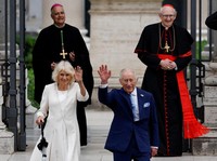 Britain's King Charles and Queen Camilla leave following a service at the Basilica of St Paul's Outside the Walls, where King Charles became a Royal Confrater of the Abbey, as part of their first state visit to the Holy See since Pope Leo XIV's elect