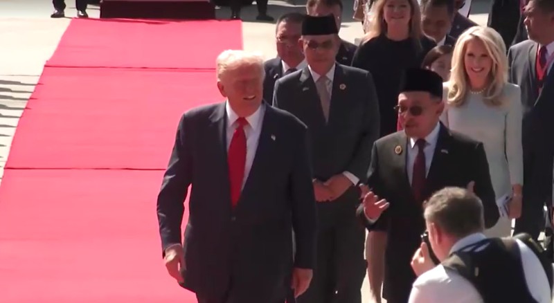 ASEAN-SUMMIT/TRUMP U.S. President Donald Trump joins the performers in a dance during a welcoming ceremony after arriving at Kuala Lumpur International Airport, to attend the 47th Association of Southeast Asian Nations (ASEAN) Summit, in Kuala Lumpur, Malaysia October 26, 2025. REUTERS/Hasnoor Hussain/Pool