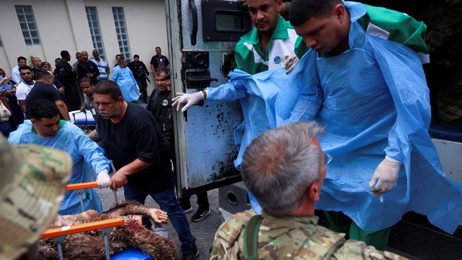 A man is detained by police officers during a police operation against drug trafficking at the favela do Penha, in Rio de Janeiro, Brazil October 28, 2025. REUTERS/Aline Massuca