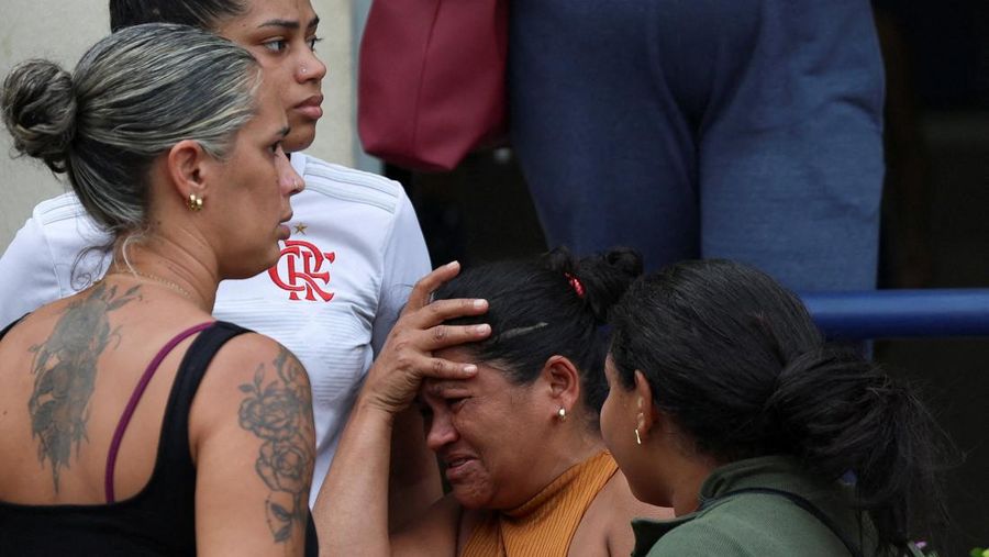A man is detained by police officers during a police operation against drug trafficking at the favela do Penha, in Rio de Janeiro, Brazil October 28, 2025. REUTERS/Aline Massuca
