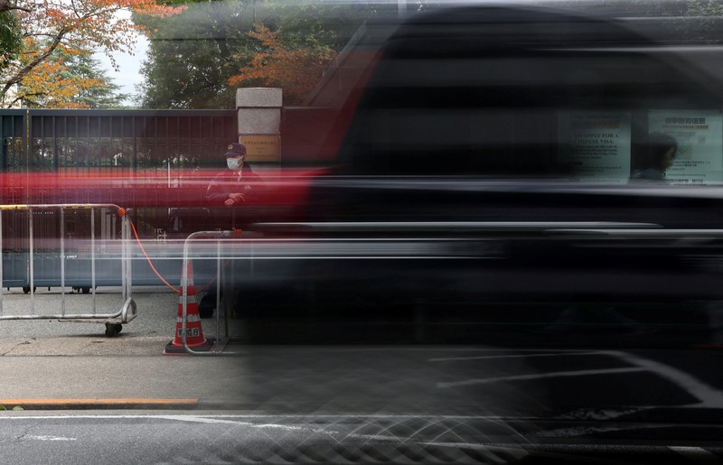 Cars drive past the Embassy of Japan in Beijing, China, November 18, 2025. REUTERS/Maxim Shemetov