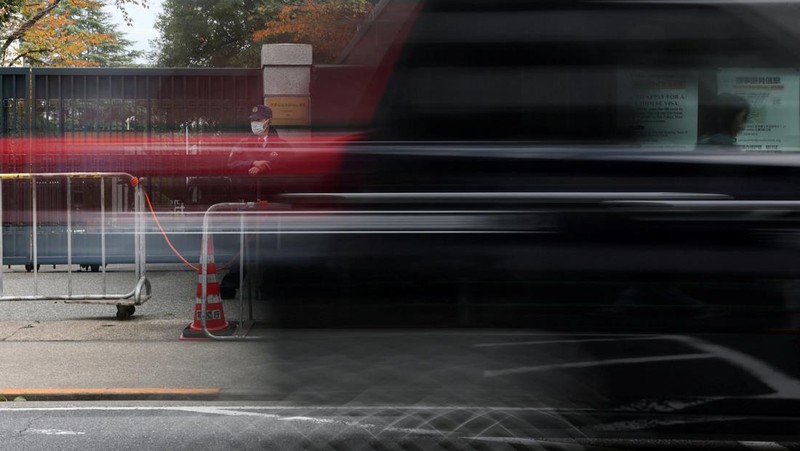 Cars drive past the Embassy of Japan in Beijing, China, November 18, 2025. REUTERS/Maxim Shemetov