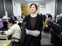 Yu Jinxin, Vice President of  East Japan International Travel Service Co., a Tokyo-based travel agency, walks at her office, amid escalating tension between China and Japan, in Tokyo, Japan November 18, 2025.  REUTERS/Issei Kato