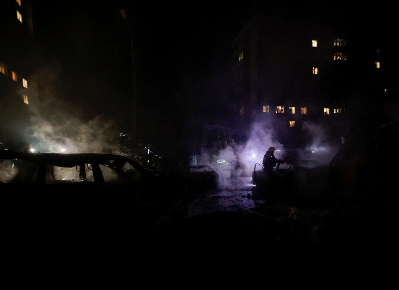 Rescuers evacuate a resident from the apartment building hit by a Russian drone strike, amid Russia's attack on Ukraine, in Kharkiv, Ukraine November 19, 2025. REUTERS/Sofiia Gatilova