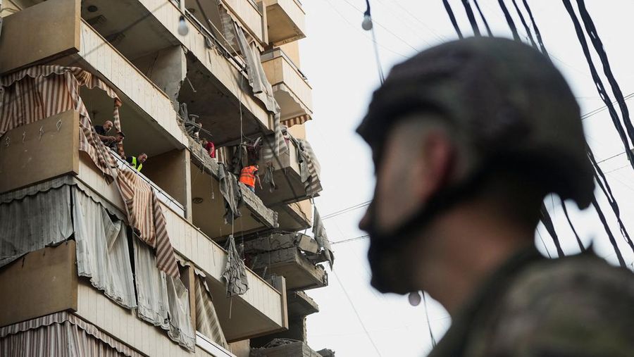 Members of the Lebanese army secure the area near the site of an Israeli strike, after Israeli military said on Sunday that it struck a militant from the Lebanese Iran-aligned Hezbollah group, in Beirut's southern suburbs, Lebanon November 23, 2025. REUTERS/Mohamed Azakir