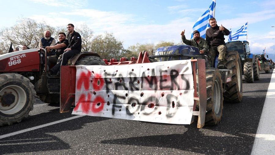 Greek farmers protesting over the delayed payment of European Union subsidies hurl stones amid tear gas at the Heraklion International Airport, in Heraklion, Crete island, Greece, December 8, 2025. REUTERS/Stefanos Rapanis     TPX IMAGES OF THE DAY