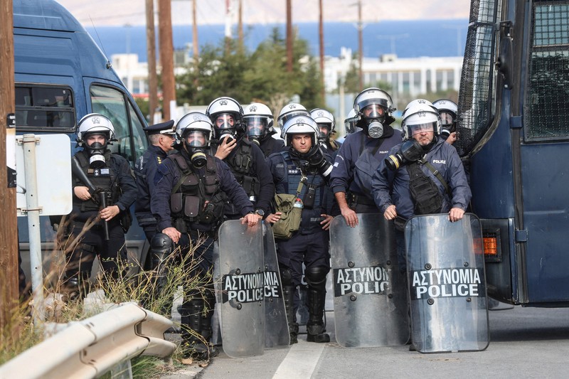 Greek farmers protesting over the delayed payment of European Union subsidies hurl stones amid tear gas at the Heraklion International Airport, in Heraklion, Crete island, Greece, December 8, 2025. REUTERS/Stefanos Rapanis     TPX IMAGES OF THE DAY