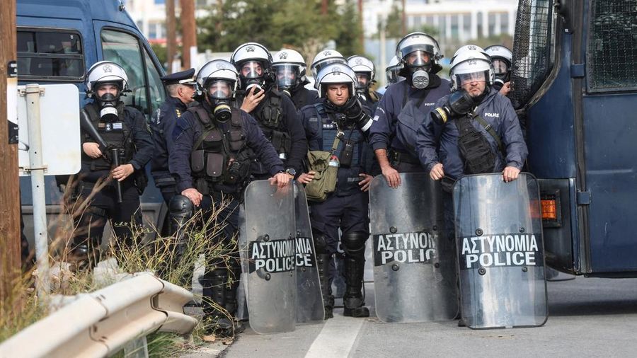 Greek farmers protesting over the delayed payment of European Union subsidies hurl stones amid tear gas at the Heraklion International Airport, in Heraklion, Crete island, Greece, December 8, 2025. REUTERS/Stefanos Rapanis     TPX IMAGES OF THE DAY