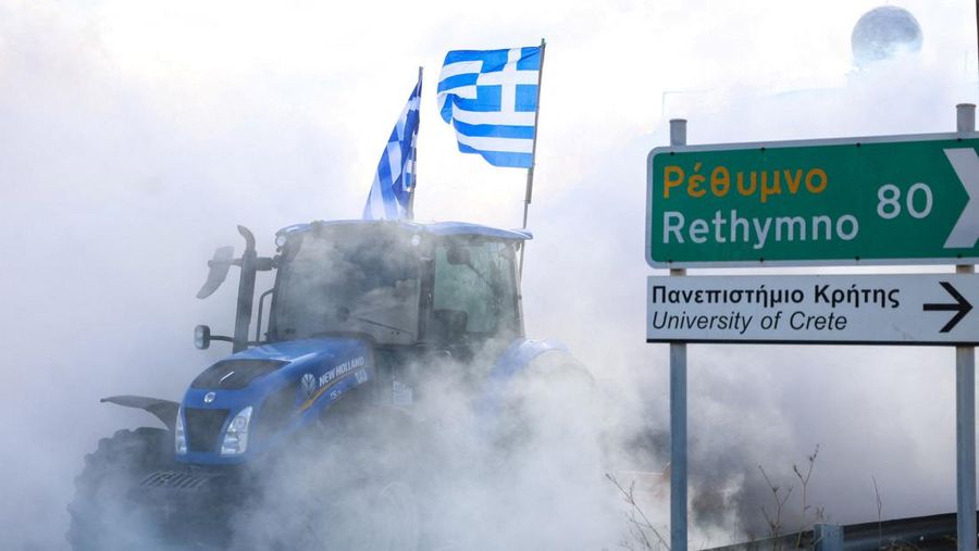 Greek farmers protesting over the delayed payment of European Union subsidies hurl stones amid tear gas at the Heraklion International Airport, in Heraklion, Crete island, Greece, December 8, 2025. REUTERS/Stefanos Rapanis     TPX IMAGES OF THE DAY