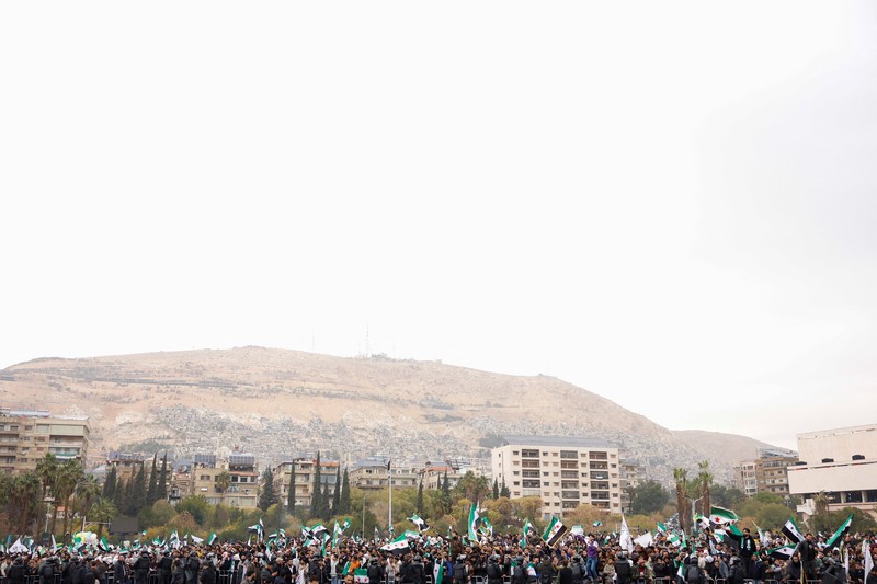 Perayaan ulang tahun pertama kejatuhan Bashar al-Assad di Lapangan Ummayad, Damaskus, Suriah, 8 Desember 2025. REUTERS/Yamam al Shaar