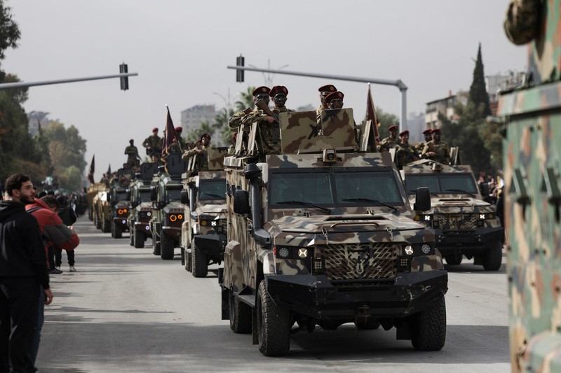 A drone view shows people gathering on the day of a military parade, as Syrians mark the first anniversary of Bashar al-Assad&#039;s fall, in Damascus, Syria December 8, 2025. REUTERS/Khalil Ashawi