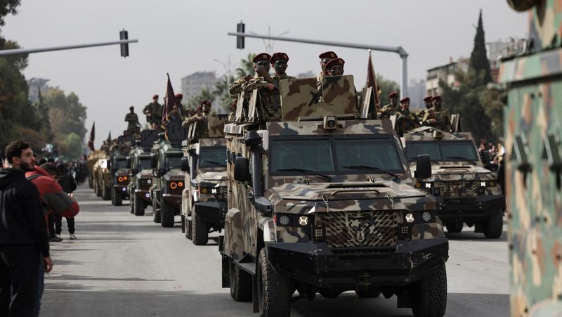 A drone view shows people gathering on the day of a military parade, as Syrians mark the first anniversary of Bashar al-Assad's fall, in Damascus, Syria December 8, 2025. REUTERS/Khalil Ashawi