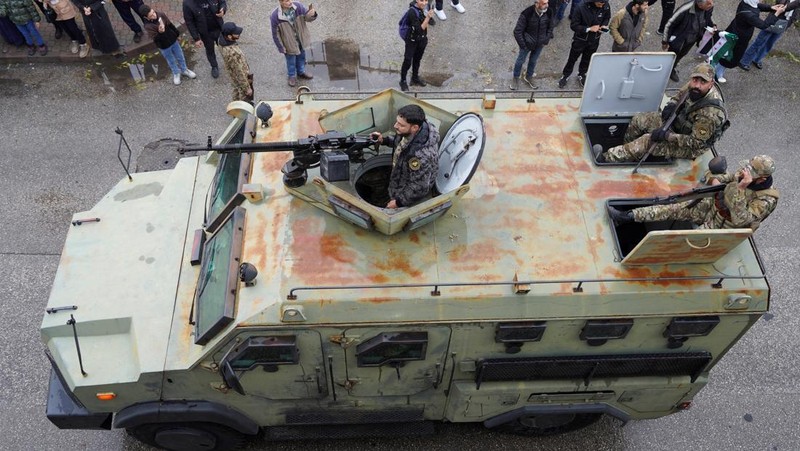 A drone view shows people gathering on the day of a military parade, as Syrians mark the first anniversary of Bashar al-Assad's fall, in Damascus, Syria December 8, 2025. REUTERS/Khalil Ashawi