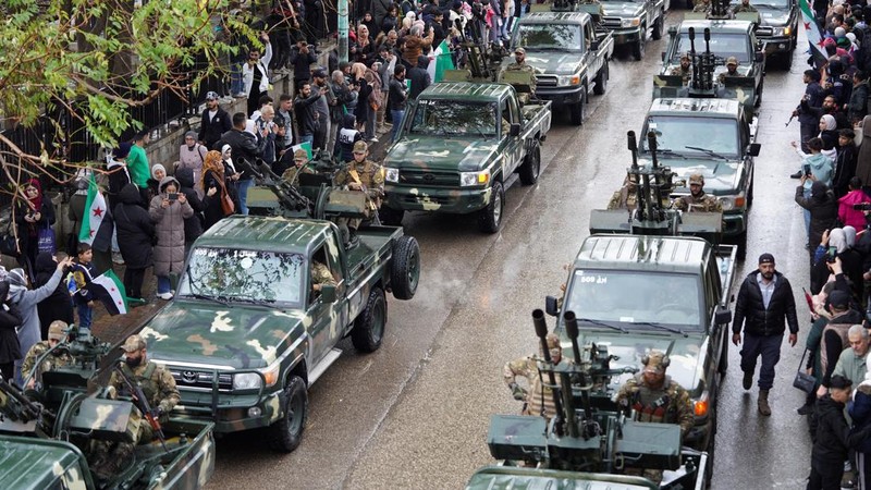 A drone view shows people gathering on the day of a military parade, as Syrians mark the first anniversary of Bashar al-Assad's fall, in Damascus, Syria December 8, 2025. REUTERS/Khalil Ashawi