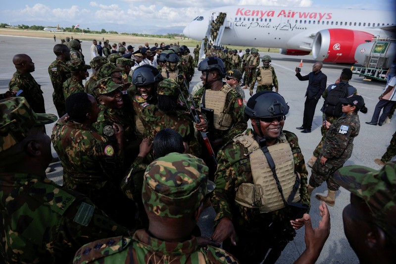 Kenyan police officers disembark in Haiti to join an expanded multinational force with a mandate to fight gangs, at Toussaint Louverture International Airport, in Port-au-Prince, Haiti December 8, 2025. REUTERS/Jean Feguens Regala