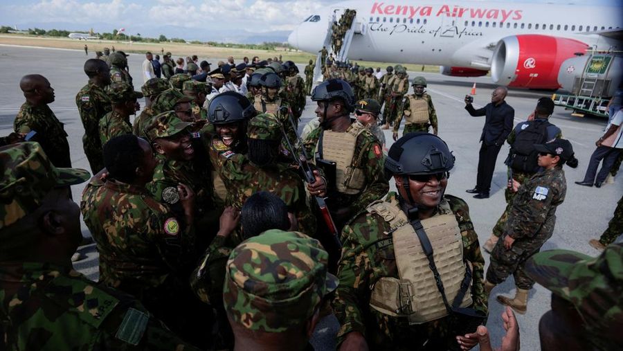 Kenyan police officers disembark in Haiti to join an expanded multinational force with a mandate to fight gangs, at Toussaint Louverture International Airport, in Port-au-Prince, Haiti December 8, 2025. REUTERS/Jean Feguens Regala