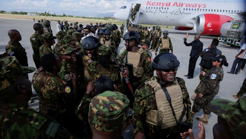Kenyan police officers disembark in Haiti to join an expanded multinational force with a mandate to fight gangs, at Toussaint Louverture International Airport, in Port-au-Prince, Haiti December 8, 2025. REUTERS/Jean Feguens Regala
