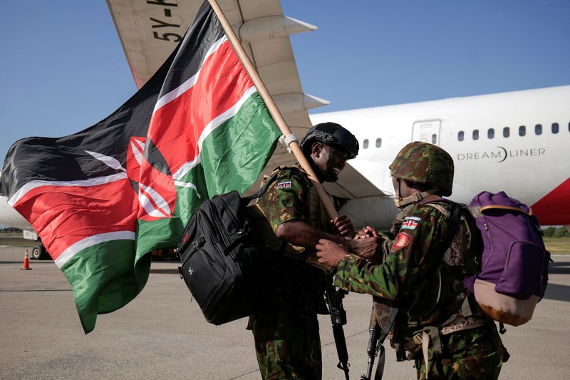 Kenyan police officers disembark in Haiti to join an expanded multinational force with a mandate to fight gangs, at Toussaint Louverture International Airport, in Port-au-Prince, Haiti December 8, 2025. REUTERS/Jean Feguens Regala
