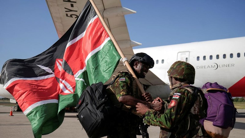 Kenyan police officers disembark in Haiti to join an expanded multinational force with a mandate to fight gangs, at Toussaint Louverture International Airport, in Port-au-Prince, Haiti December 8, 2025. REUTERS/Jean Feguens Regala