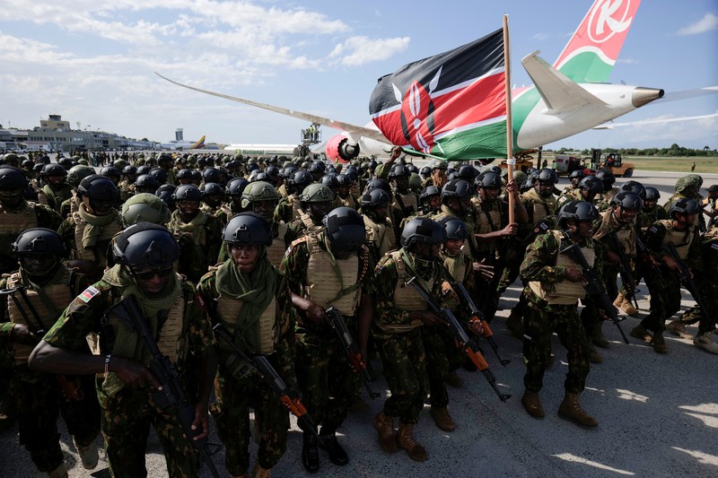 Kenyan police officers disembark in Haiti to join an expanded multinational force with a mandate to fight gangs, at Toussaint Louverture International Airport, in Port-au-Prince, Haiti December 8, 2025. REUTERS/Jean Feguens Regala