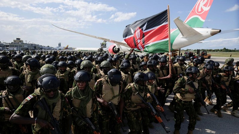 Kenyan police officers disembark in Haiti to join an expanded multinational force with a mandate to fight gangs, at Toussaint Louverture International Airport, in Port-au-Prince, Haiti December 8, 2025. REUTERS/Jean Feguens Regala