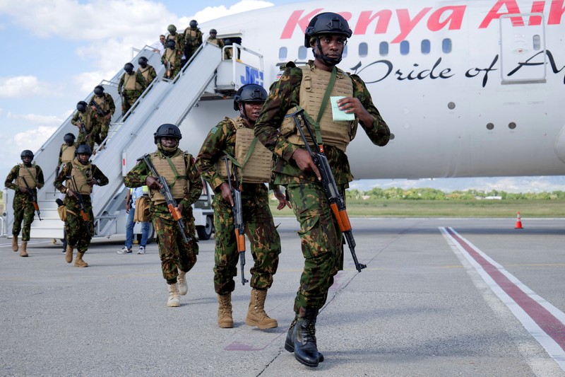 Kenyan police officers disembark in Haiti to join an expanded multinational force with a mandate to fight gangs, at Toussaint Louverture International Airport, in Port-au-Prince, Haiti December 8, 2025. REUTERS/Jean Feguens Regala