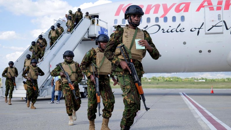 Kenyan police officers disembark in Haiti to join an expanded multinational force with a mandate to fight gangs, at Toussaint Louverture International Airport, in Port-au-Prince, Haiti December 8, 2025. REUTERS/Jean Feguens Regala