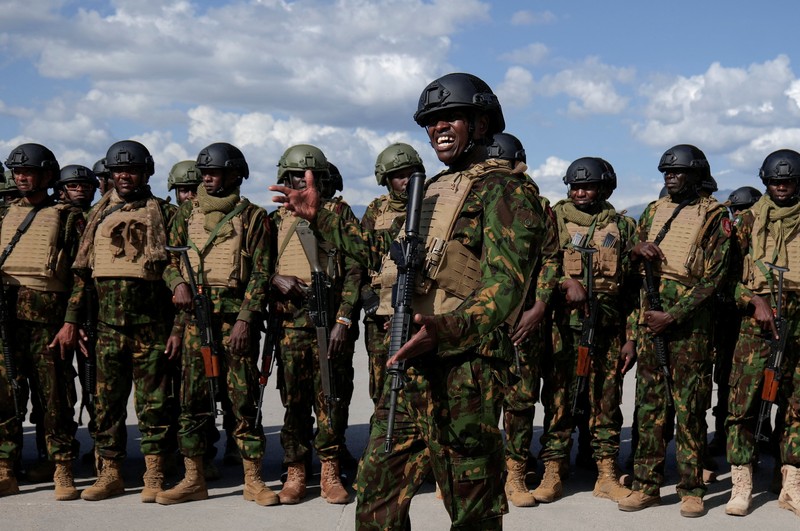 Kenyan police officers disembark in Haiti to join an expanded multinational force with a mandate to fight gangs, at Toussaint Louverture International Airport, in Port-au-Prince, Haiti December 8, 2025. REUTERS/Jean Feguens Regala