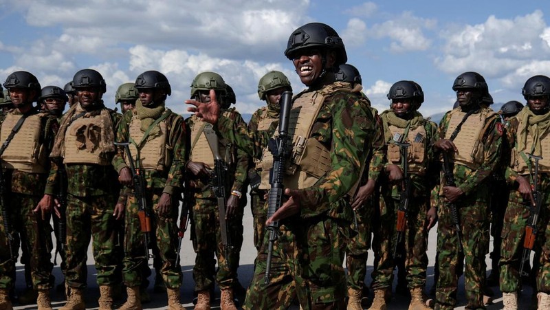 Kenyan police officers disembark in Haiti to join an expanded multinational force with a mandate to fight gangs, at Toussaint Louverture International Airport, in Port-au-Prince, Haiti December 8, 2025. REUTERS/Jean Feguens Regala