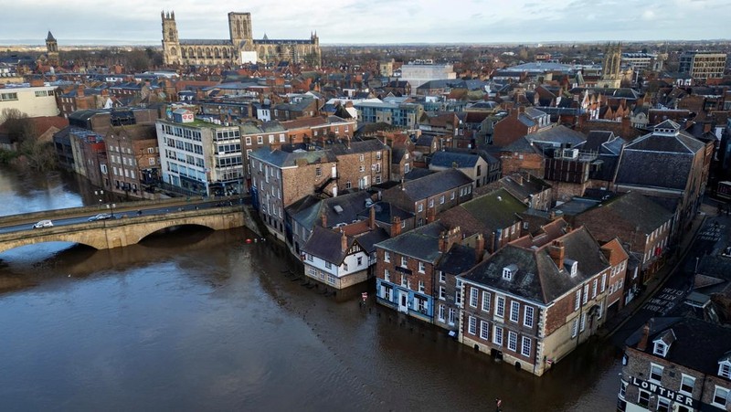 A drone view shows buildings near River Ouse, which burst its banks and partially flooded sections of nearby roads, in York, Britain, December 10, 2025. REUTERS/Phil Noble