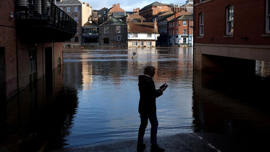 A drone view shows buildings near River Ouse, which burst its banks and partially flooded sections of nearby roads, in York, Britain, December 10, 2025. REUTERS/Phil Noble