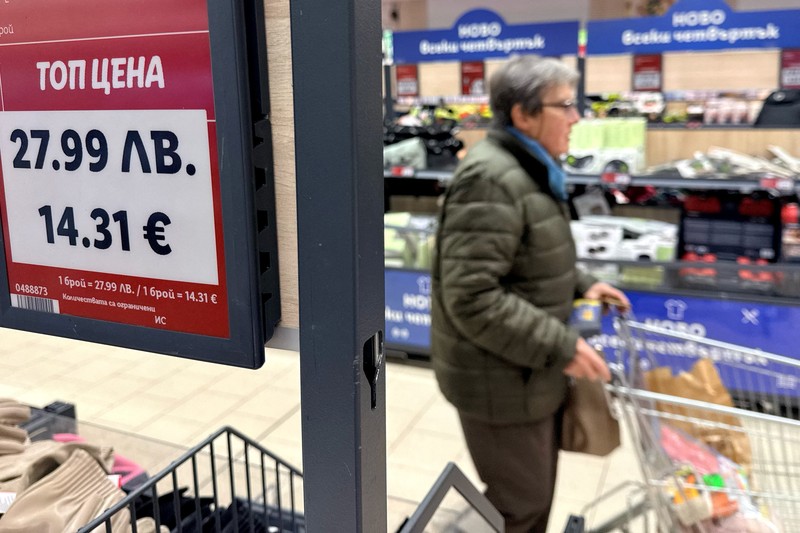 A woman shops inside a Lidl store, as prices are displayed in both the Bulgarian lev and euro currencies, ahead of Bulgaria's adoption of the euro on January 1, 2026, in Sofia, Bulgaria, December 18, 2025. REUTERS/Fedja Grulovic