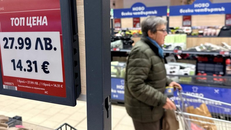 A woman shops inside a Lidl store, as prices are displayed in both the Bulgarian lev and euro currencies, ahead of Bulgaria's adoption of the euro on January 1, 2026, in Sofia, Bulgaria, December 18, 2025. REUTERS/Fedja Grulovic