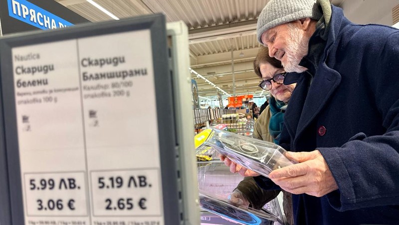 A woman shops inside a Lidl store, as prices are displayed in both the Bulgarian lev and euro currencies, ahead of Bulgaria's adoption of the euro on January 1, 2026, in Sofia, Bulgaria, December 18, 2025. REUTERS/Fedja Grulovic