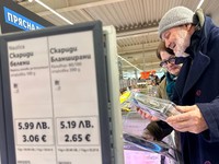 People shop inside a Lidl store, as prices are displayed in both the Bulgarian lev and euro currencies, ahead of Bulgaria's adoption of the euro on January 1, 2026, in Sofia, Bulgaria, December 18, 2025. REUTERS/Fedja Grulovic