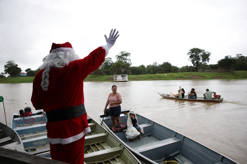People dressed as Santa Claus ride their motorcycles through Barcelona, Spain, December 21, 2025. REUTERS/ Bruna Casas