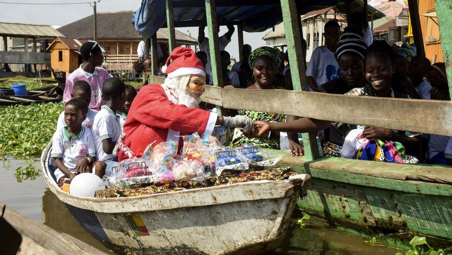 People dressed as Santa Claus ride their motorcycles through Barcelona, Spain, December 21, 2025. REUTERS/ Bruna Casas