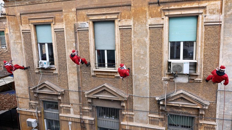 People dressed as Santa Claus ride their motorcycles through Barcelona, Spain, December 21, 2025. REUTERS/ Bruna Casas