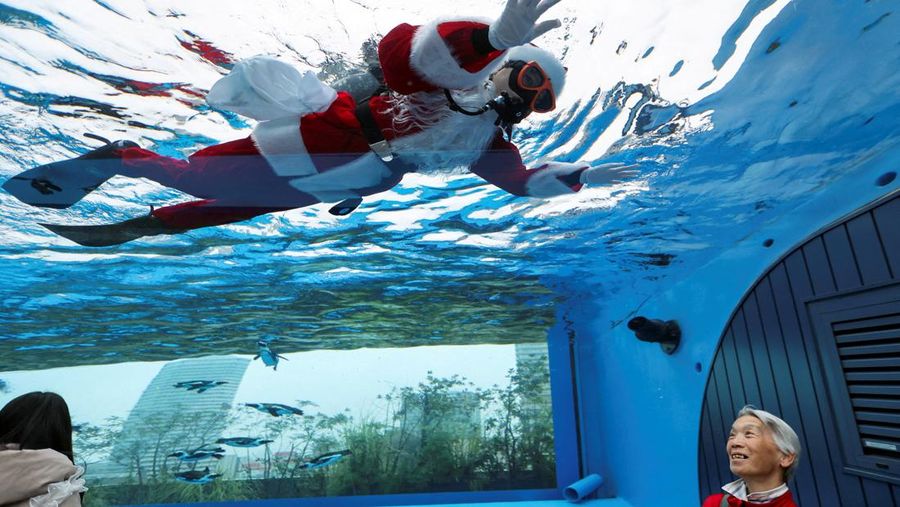People dressed as Santa Claus ride their motorcycles through Barcelona, Spain, December 21, 2025. REUTERS/ Bruna Casas