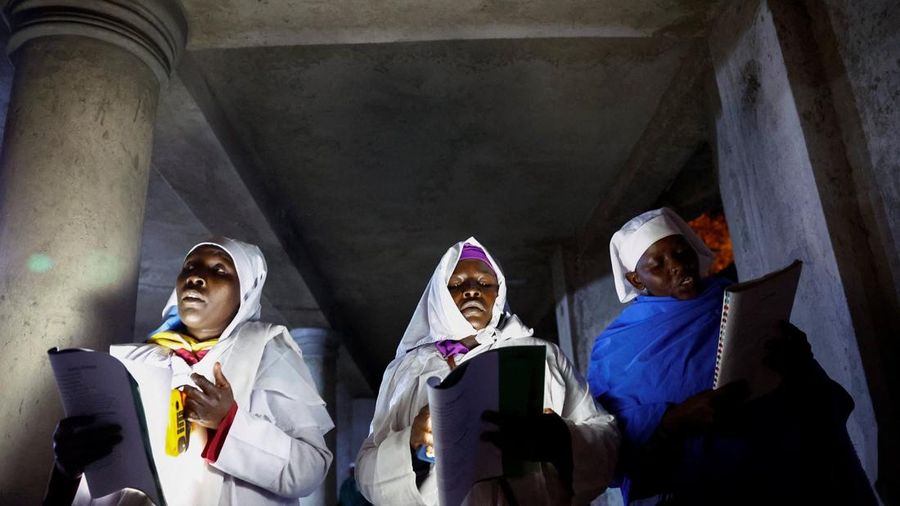 Believers hold electric candles during a Christmas Mass at Indonesia Arena stadium in Jakarta, Indonesia, December 24, 2025. REUTERS/Ajeng Dinar Ulfiana