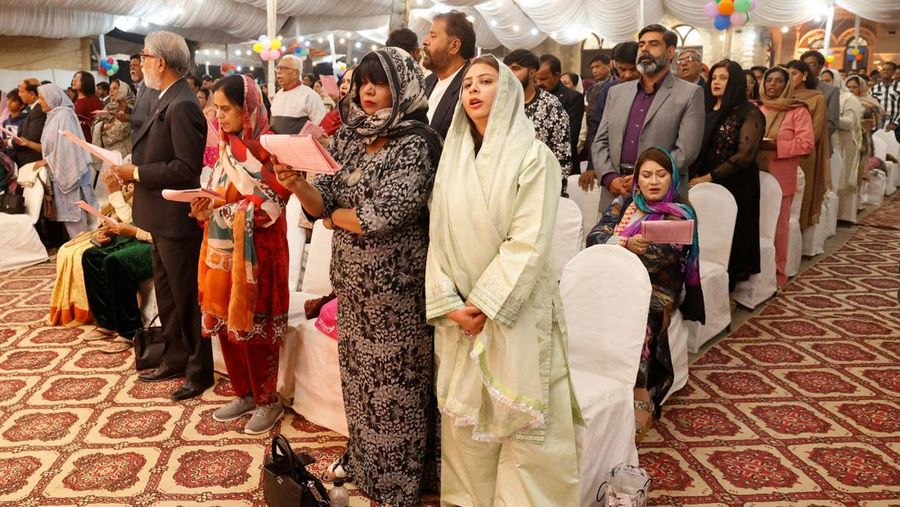 Believers hold electric candles during a Christmas Mass at Indonesia Arena stadium in Jakarta, Indonesia, December 24, 2025. REUTERS/Ajeng Dinar Ulfiana
