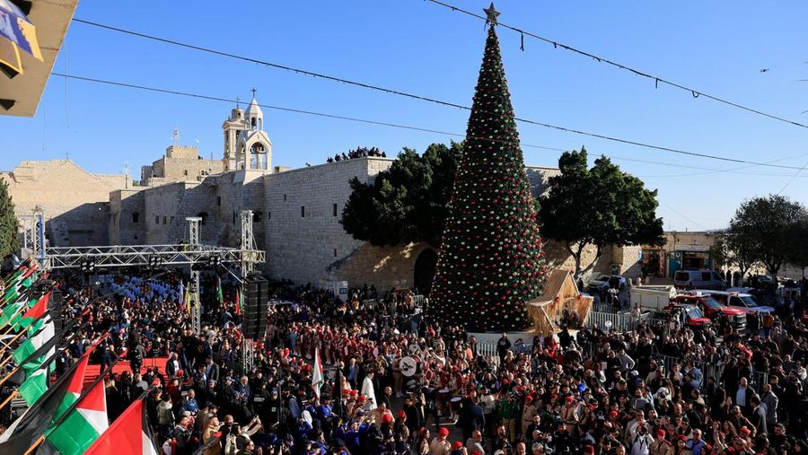 Palestinian scouts parade at Manger Square outside the Church of the Nativity in Bethlehem, in the Israeli-occupied West Bank, on Christmas Eve, December 24, 2025. REUTERS/Ammar Awad